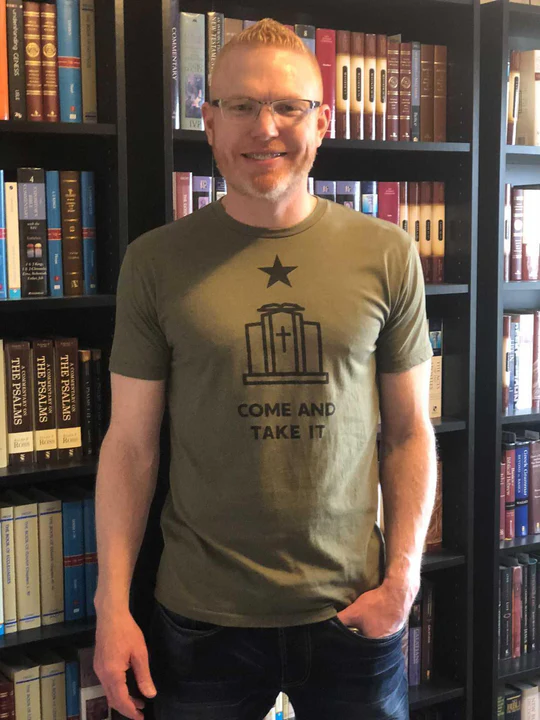 Supporter wearing Come and Take It shirt